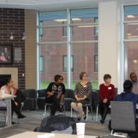 Students and faculty discussing important tasks like the students' futures at GVSU and beyond